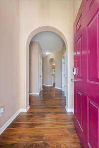 The entry foyer is welcoming with a lovely arched opening.