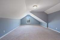 Upstairs is a great bonus room with window overlooking front yard.