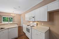 The kitchen incudes the stove, microwave and dishwasher.