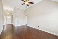 Notice again the tall ceilings and warm tones in the living room.