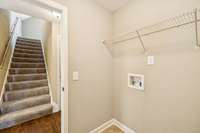 The laundry room is also on the main level giving it easy access for the majority of the bedrooms and is located just off of the attached garage.