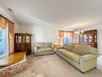 This large open living/dining space is very flexible. There are numerous possibilities and options for this space!