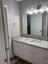 New sink, fixtures, and countertops in this spacious bathroom!