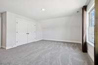 Double door closet space for your upper level third bedroom