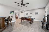 This level could easily be used for multi-generational living - no stair entry directly from the double door garage entry or back patio door.  It already has a full bathroom and bedroom area (no closet).