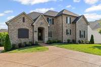 A traditional single family estate home with a fully finished walk out basement in the exclusive Kennesaw Farms.