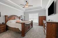 On the opposite side of the home, you can retreat to your large primary suite.