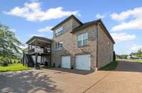4 car (2 door) tandem garage with large entry and turnaround.  Plenty of space for your cars