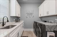 Doing laundry is not everyone's favorite chore - but doing it in this laundry room makes it a little better!