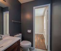 Shared half bathroom between the second and third bedrooms.