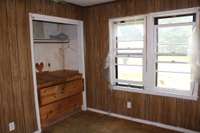 Large closet with built-ins and lots of windows in this guest bedroom!!