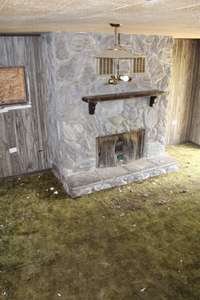 Den with a fireplace or could be made to a very nice Master Suite!!