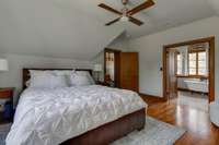 French doors open to large bath in primary bedroom.