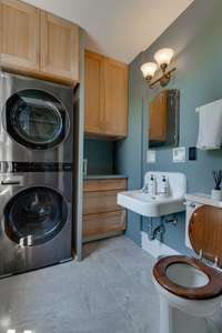 This half bath - laundry room is just off the sitting area of the Butlers Pantry.