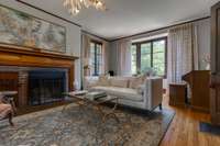 Living room with wood burning fireplace.