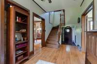 View from the entrance hall way.  It has 2 doors. I t also has access to the 2nd staircase that leads to the Studio.