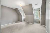 Cute dormer windows accent the space