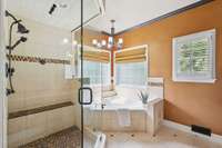 Large bench seating in shower and light throughout this private ensuite