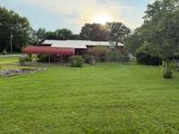 View from the back of the yard to the rear of the home.