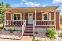 The covered front porch adds additional space to enjoy in the shade.