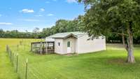 Pole barn has chicken house attached.