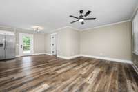 Just inside the front door you are greeted with laminate hardwood floors, new lighting and fresh, neutral paint with tons of natural light.
