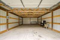 New trusses, new framing, new metal siding, new metal roof and gutters.
