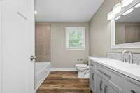 The main hall bath is spacious and well appointed.