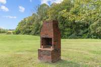 Outdoor fireplace...great for a bar-b-q or just sitting by the fire.