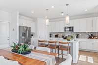 This is a photo of one of our model homes. Please know that some of the exterior and interior finishes, paint, and features may vary.