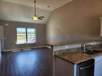 Vaulted Ceiling in Living Room and Kitchen.  Picture of Similar House.