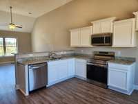 Another View of the Large Kitchen.  Buyers can select Brown or White Cabinets, if they have not been ordered.   Picture of Similar House.