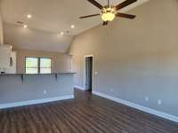 Living Room and Kitchen has LV Plank Flooring that is scratch resistant.   Picture of Similar House.