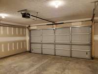 Two Car Garage with Garage Door Opener. Previous Home is pictured.