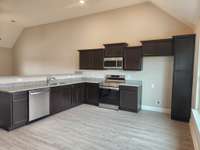 Kitchen has Extra Cabinets and Counter Space.  Picture of Similar House.