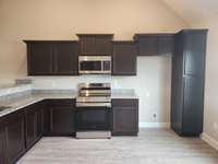 House will have Brown, White or Charcoal Cabinets.  Picture of Similar House.