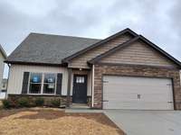 New House with 2 Car Garage and Double Wide Driveway.  Picture of Previous House.