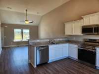Kitchen features beautiful Custom Cabinets and Granite Counter Tops. Picture of Previous House.