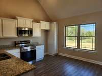 Double Windows in the Dining Area provide Natural Light.  Picture of Previous House.
