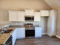 Extra Cabinets including a Cabinet Pantry.  Picture of Similar House.