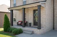 This all brick 1 owner home offers a roomy covered front porch