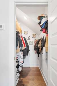 Before we head upstairs, check out this amazing closet on the main level, just inside the front door!