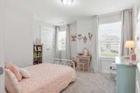 Great sized Guest Room with double door closet.  Drapes in this room will not convey with the home.