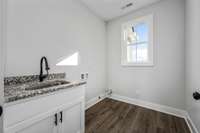 Laundry room with utility sink