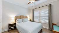 Bedroom 3 features crown molding, hardwood floors, plantation shutters, and a ceiling fan.