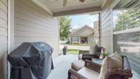 The home has a covered patio area, great for grilling.  This space also has a ceiling fan.