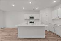 The kitchen has a huge corner pantry- you will be shocked by how much storage is in there!