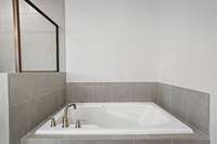 Picture of model home and not of actual home being built.  Colors and selections may vary.  Pick the colors and selections you desire with this presale opportunity.  This option available in Owners bath with separate Tile shower and Tile surround tub