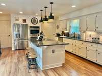 DOUBLE ovens, Grantite Countertops, Cooktop Island, Island Seating, Stainless Appliances, Large Pantry