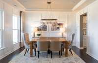 ***Photo from a Riverview model home in another community***  A formal Dining Room is included with this home, perfect for dinner parties. We have also included a Butler's Pantry and pass-through into the Kitchen!
